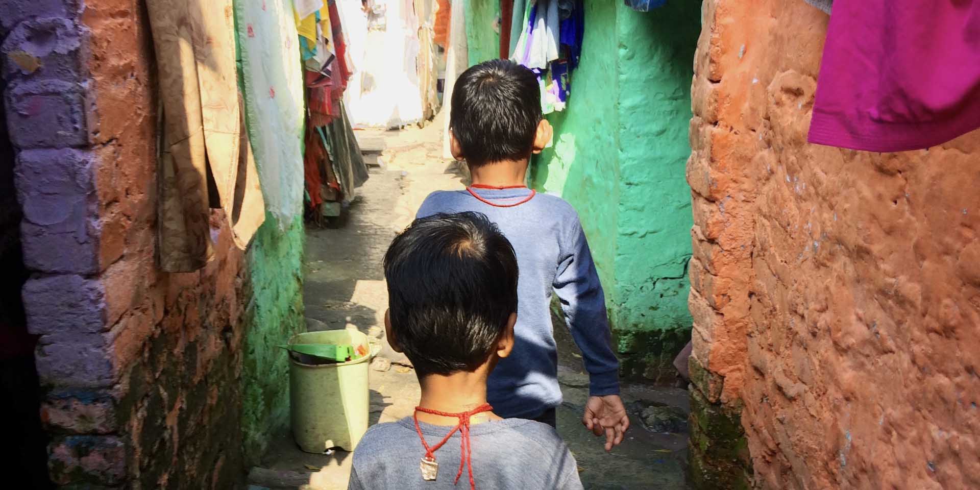 Two children in playing in a gully